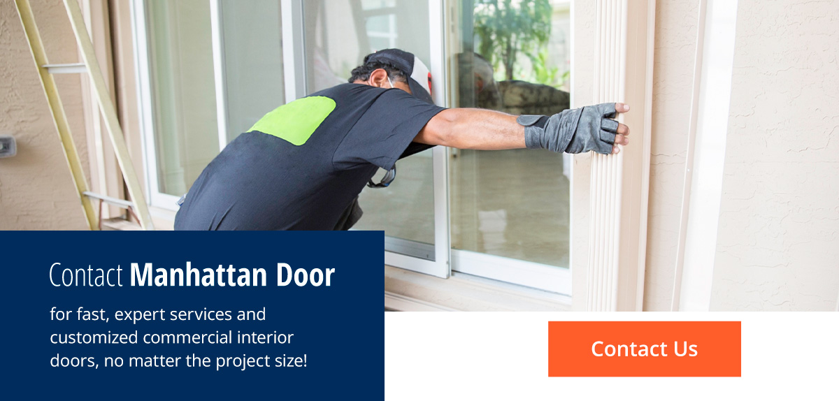 worker fixing a sliding door next to the words contact manhattan door